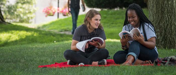 Students sitting in Cathedral lawn